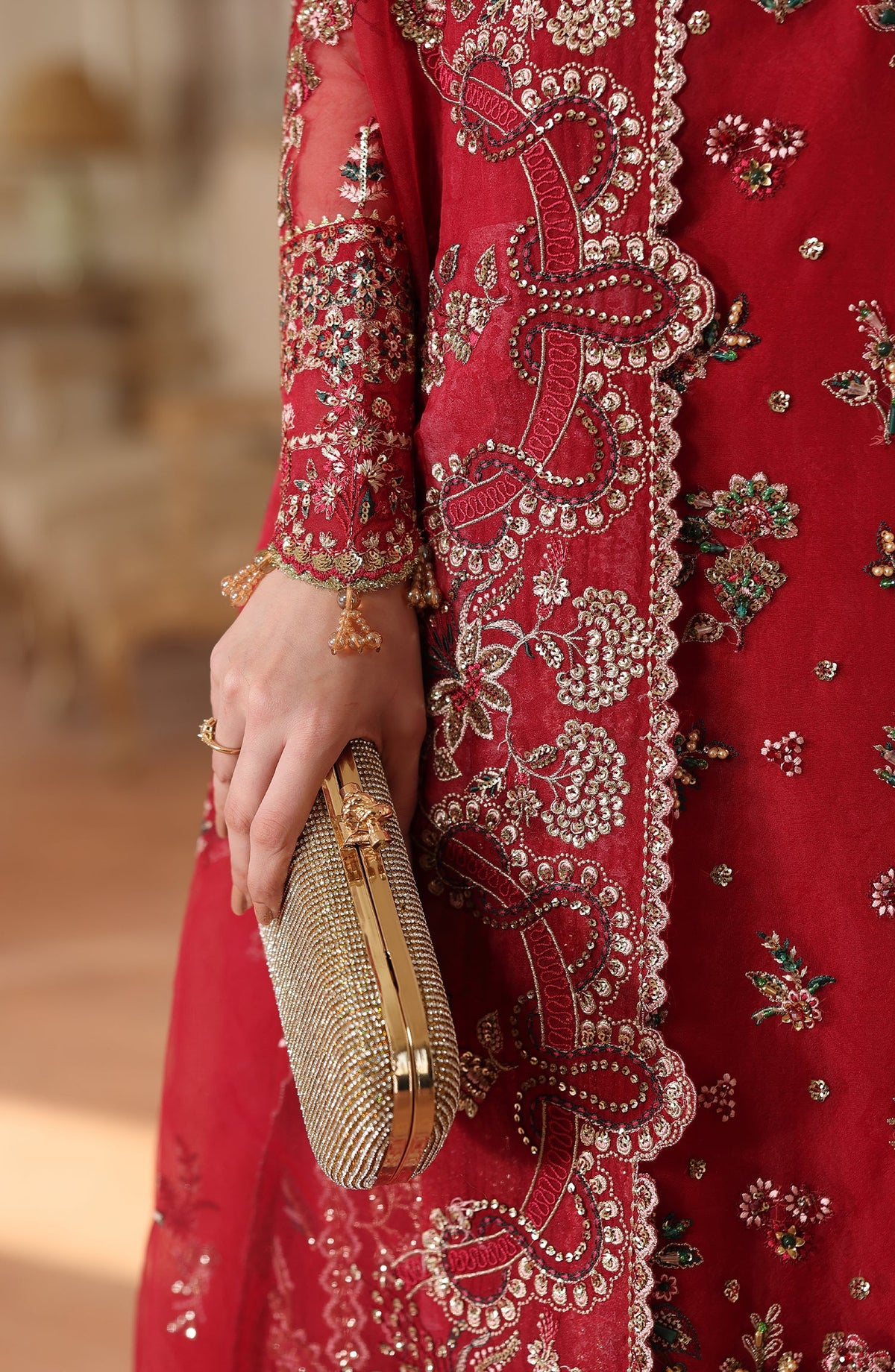 Model wearing Surkh Gul luxury women festive dress