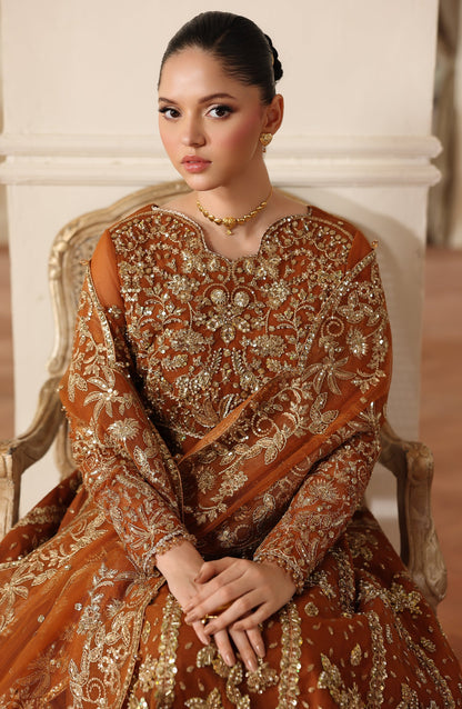 Woman wearing a traditional embroidered saree in an elegant setting